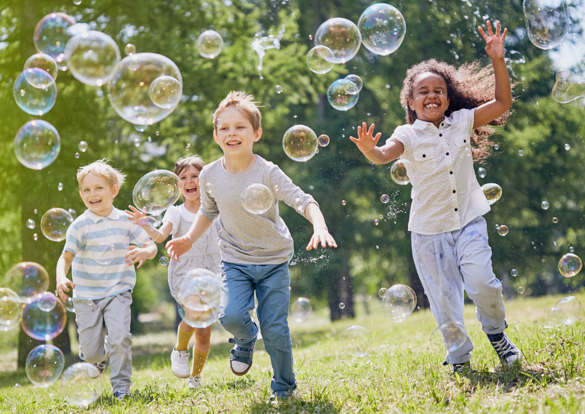 summer break kids playing with bubbles